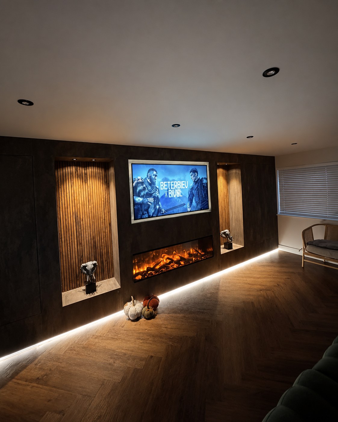 Media wall illuminated in the evening with fire lit and oak acoustic panelling