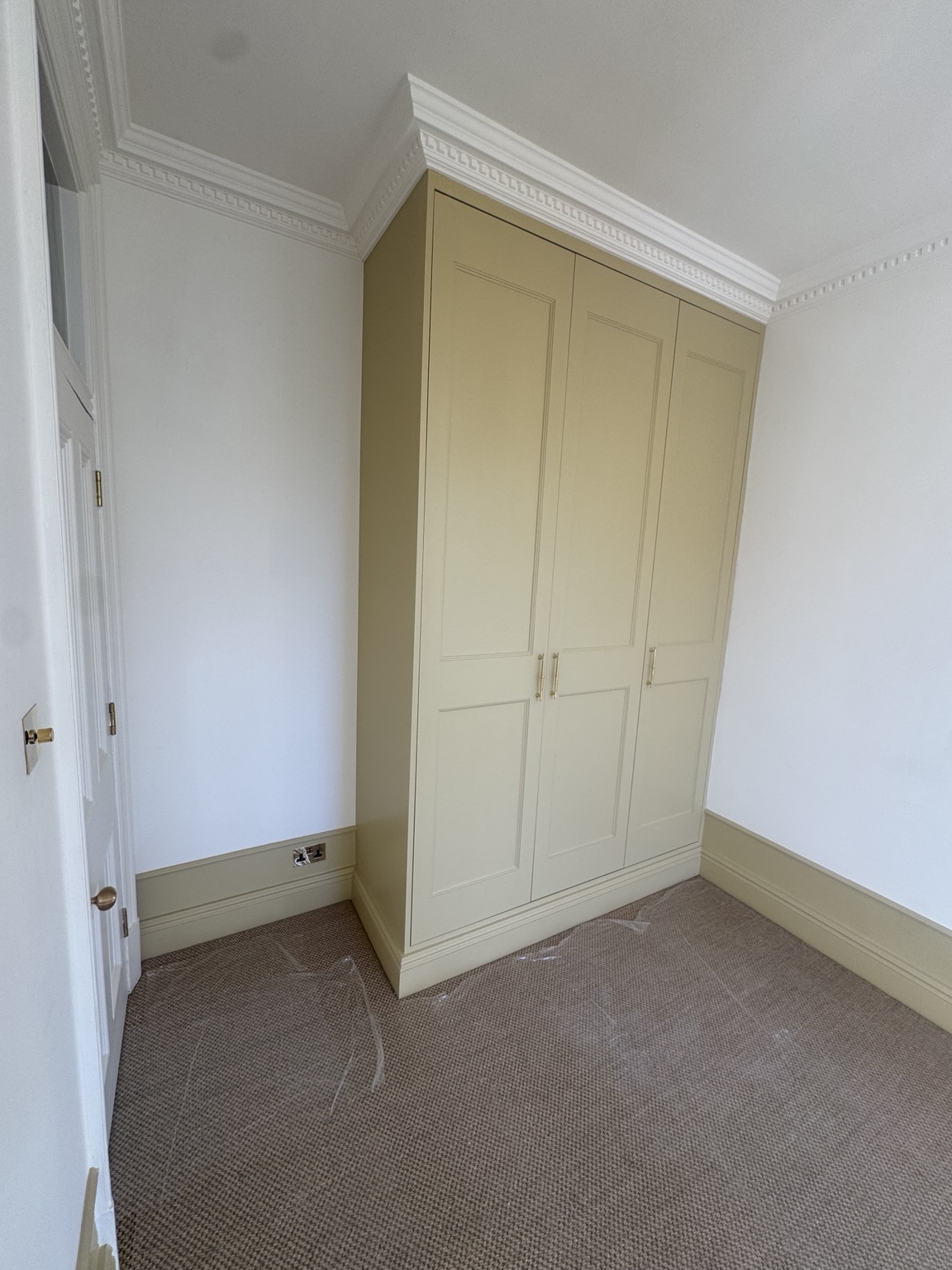 Bedroom 2 shaker wardrobe doors with inset beading and a different exterior colour at York Mansion