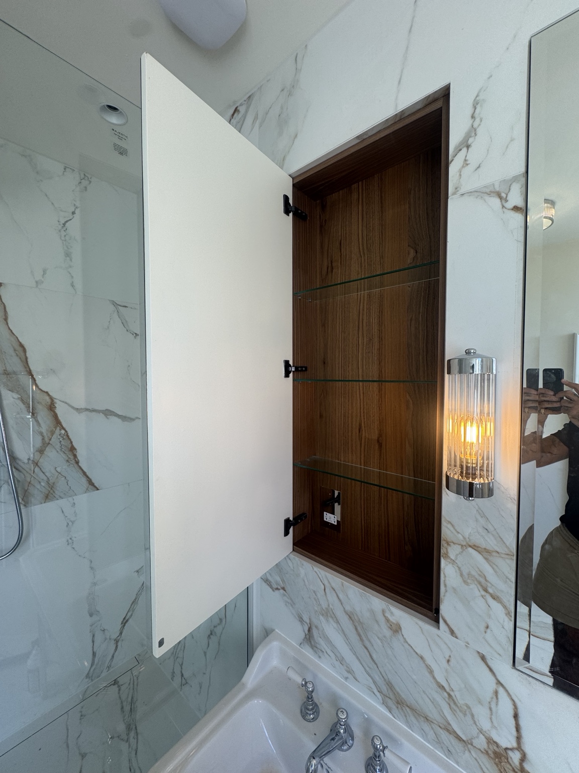 Open walnut veneer mirrored cabinet with glass shelves and a shaving point