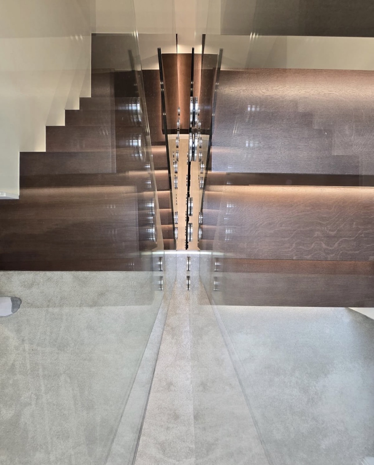 Top-down view of the oak treads and glass balustrade
