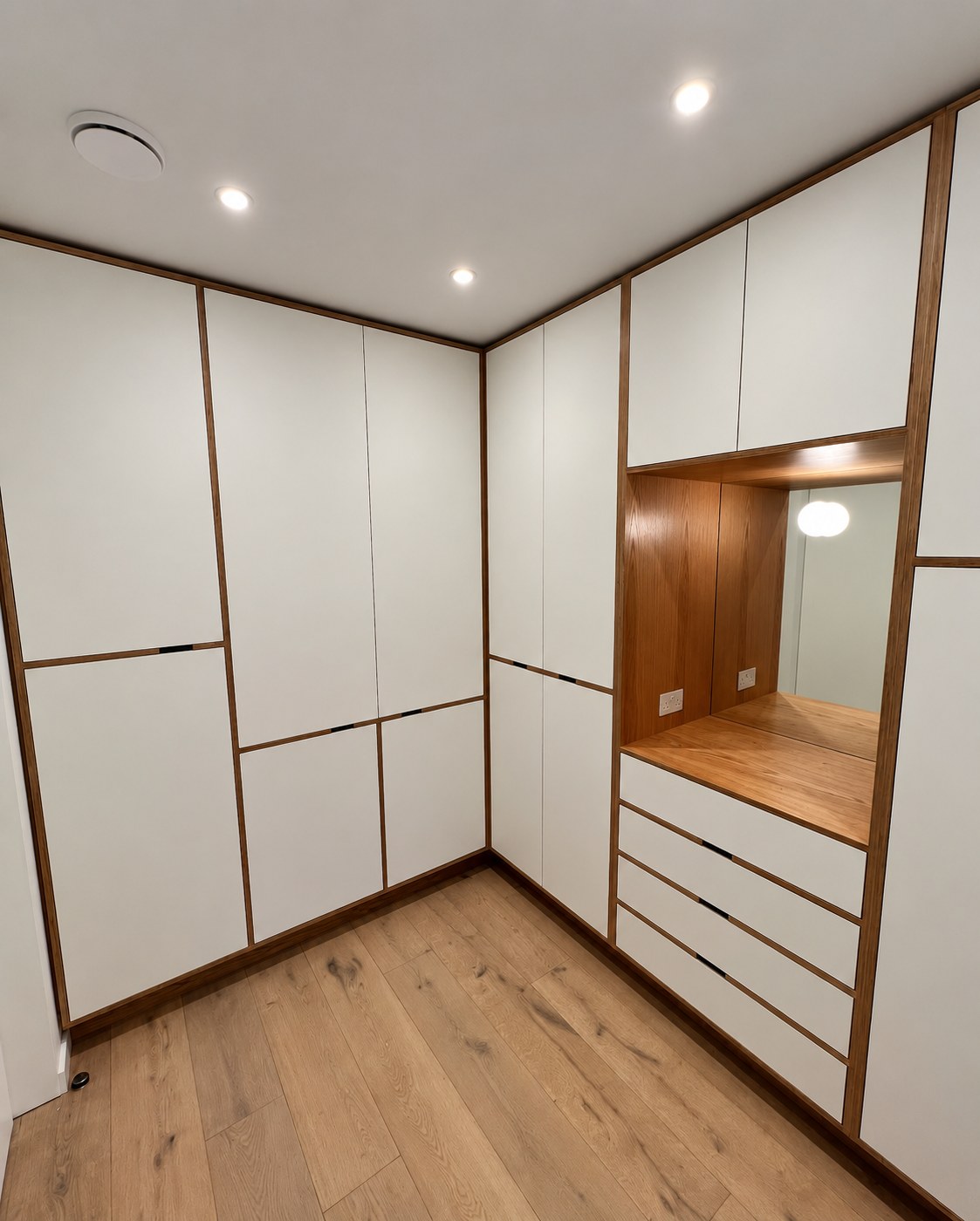 Sprayed MDF and birch plywood walk-in wardrobe at Mourings, Richmond